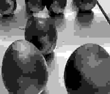 Hand Painting The Chocolate Eggs With Black And Purple Cocoa Butter Hand Painting The Chocolate Eggs With Black And Purple Cocoa Butter